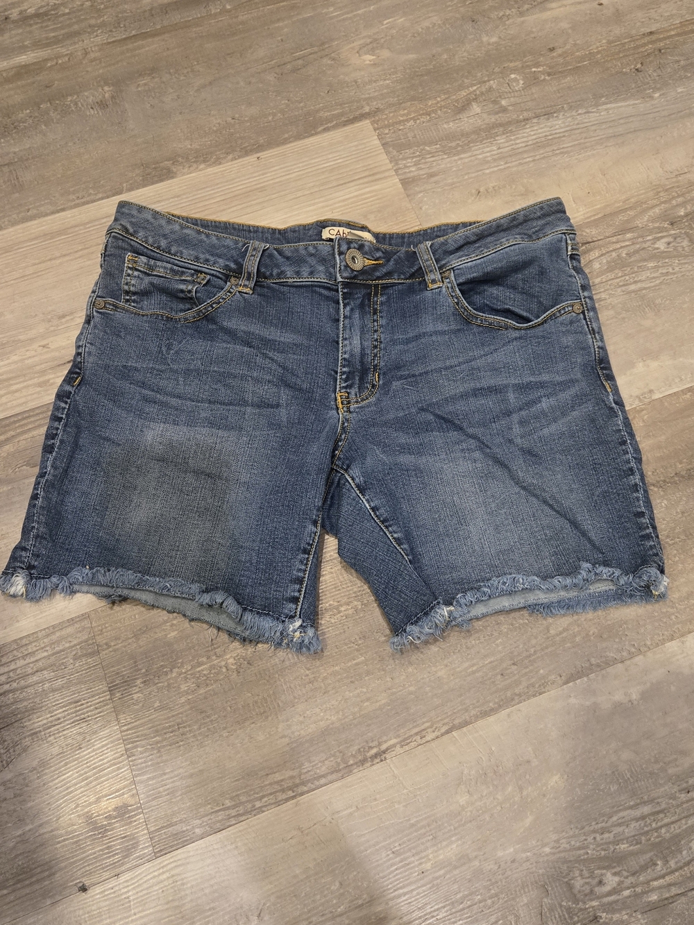 CAbi Medium Blue Denim Cutoff Shorts with Frayed Hem